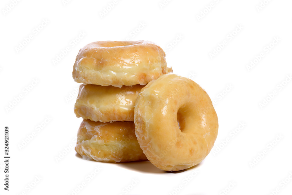 Several glazed donuts on a white background