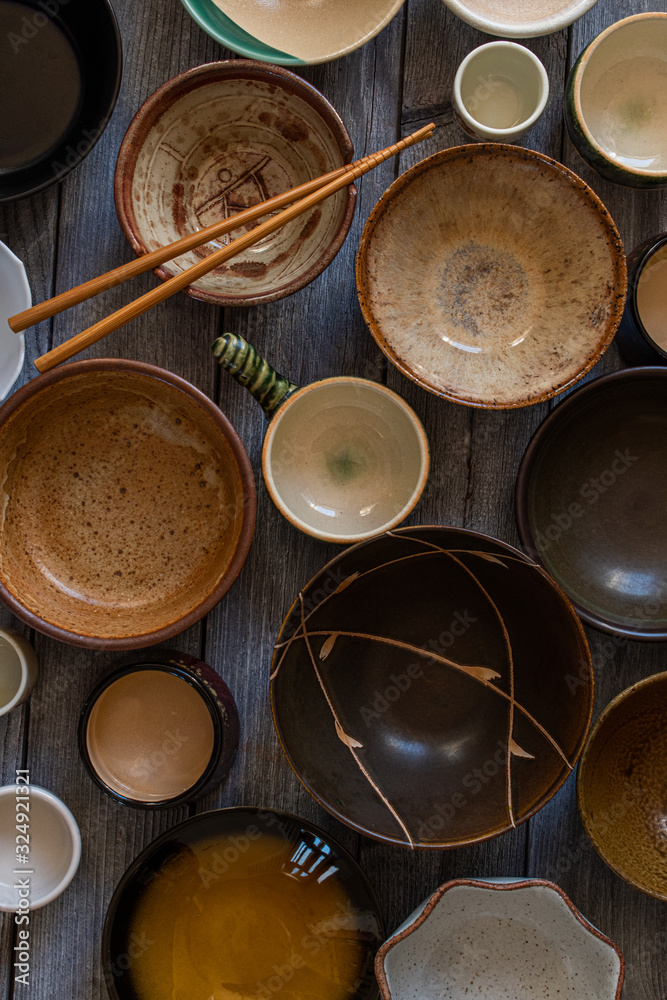 Assorted empty Asian ceramic bowls on wooden table Assorted empty Asian ceramic bowls on wooden table