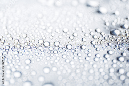 Water rain drops or water drops on white background. Many water drops on canvas
