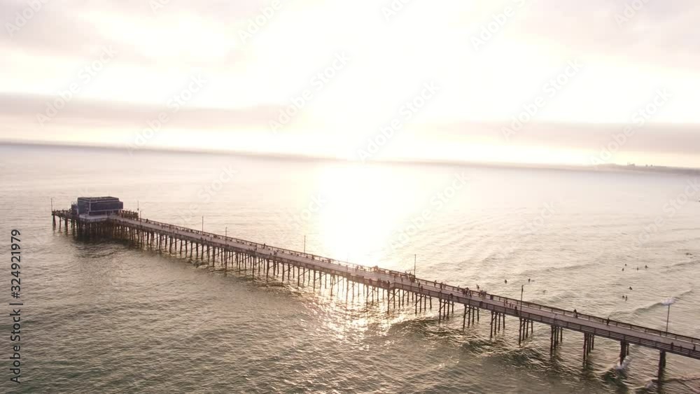 Sunset over Newport Beach pier, wide aerial Sunset over Newport Beach pier, wide aerial