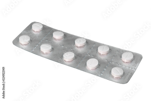 Blister of white pills isolated on white  background