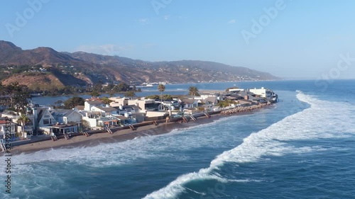 Pan right aerial, coastal homes in Malibu