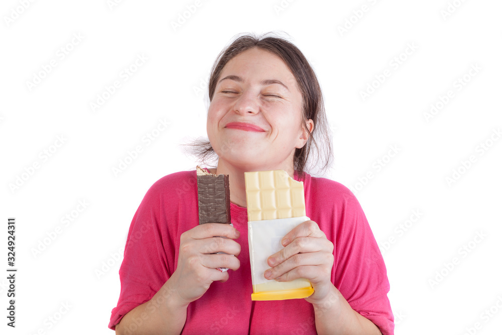 young girl eating sweets. chocolate and wafer isolated on white. smiley face expression young girl eating sweets. chocolate and wafer isolated on white. smiley face expression