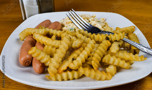 hot dog with fries and macaroni salad