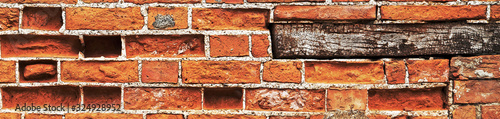 Long panorama of brick wall, as a background texture for design - in a panorama / header / banner. photo