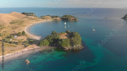 Aerial: Fly-over of a beautiful tropical beach photo