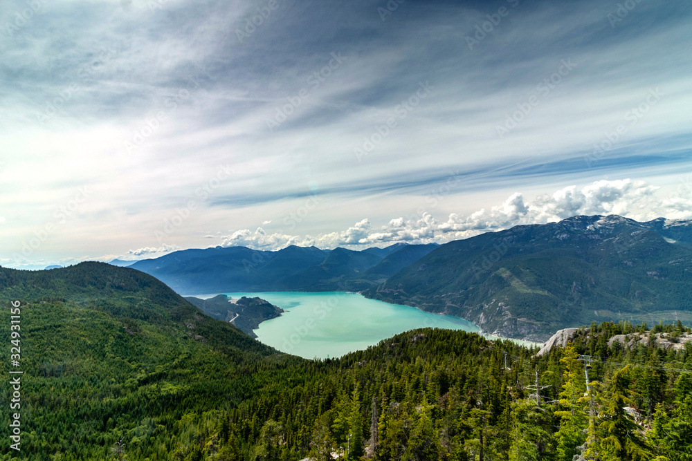 Spectacular scenery of the teal ocean, mountain and clouds, Squamish, BC, Canada