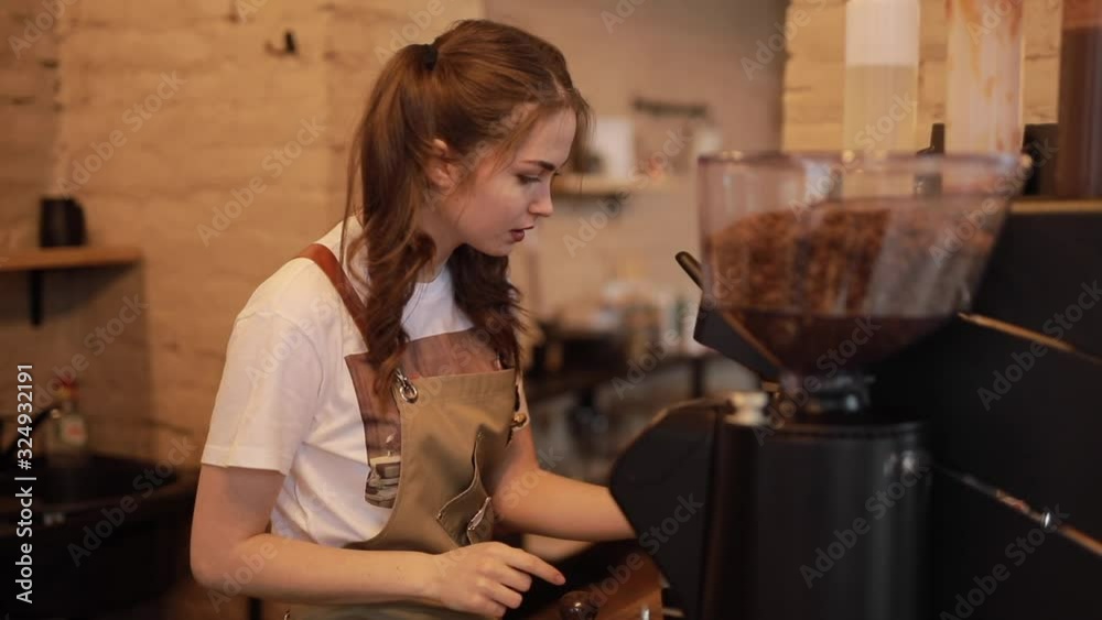 Barista woman make a coffee in the cafeteria with smile Barista woman make a coffee in the cafeteria with smile