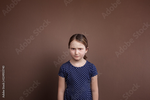 the little girl is worried. child psychology, divorce of parents, father drinks alcohol. social problem. Family conflict. photo