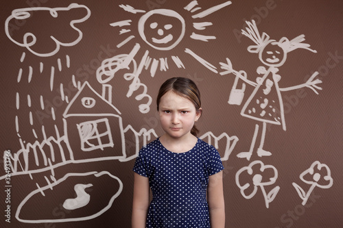 the little girl is worried. child psychology, divorce of parents, father drinks alcohol. social problem. Family conflict. photo