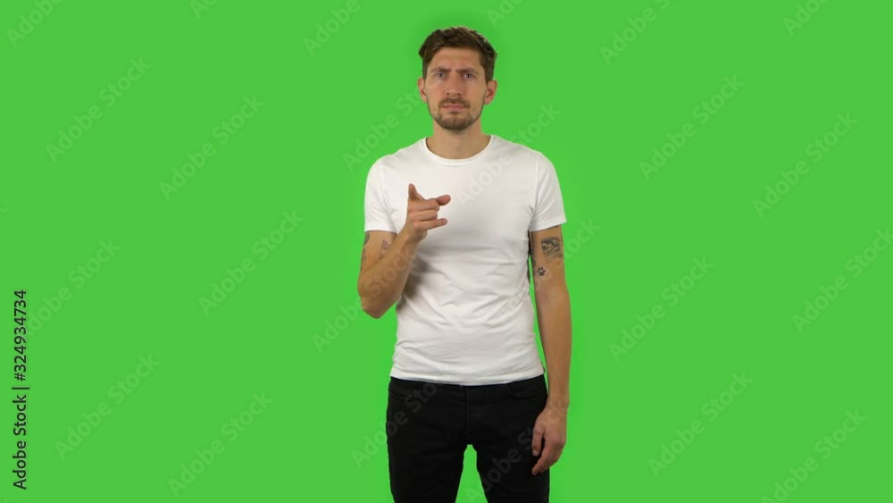 Confident guy is scolding, shaking his index finger. Green screen