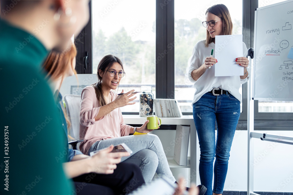 Businesswomen during meeting at a flipchart Businesswomen during meeting at a flipchart