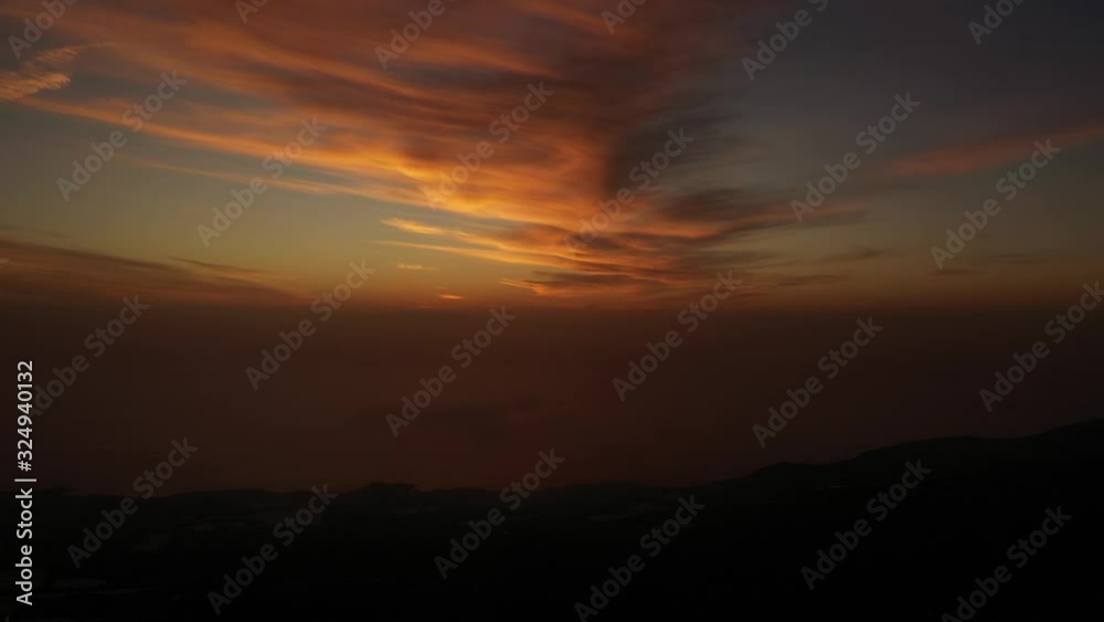 beautiful bright orange sunset on the Canary Islands.sun in clouds at sunset.Aerial view,Santa Cruz de Tenerife. beautiful bright orange sunset on the Canary Islands.sun in clouds at sunset.Aerial view,Santa Cruz de Tenerife.
