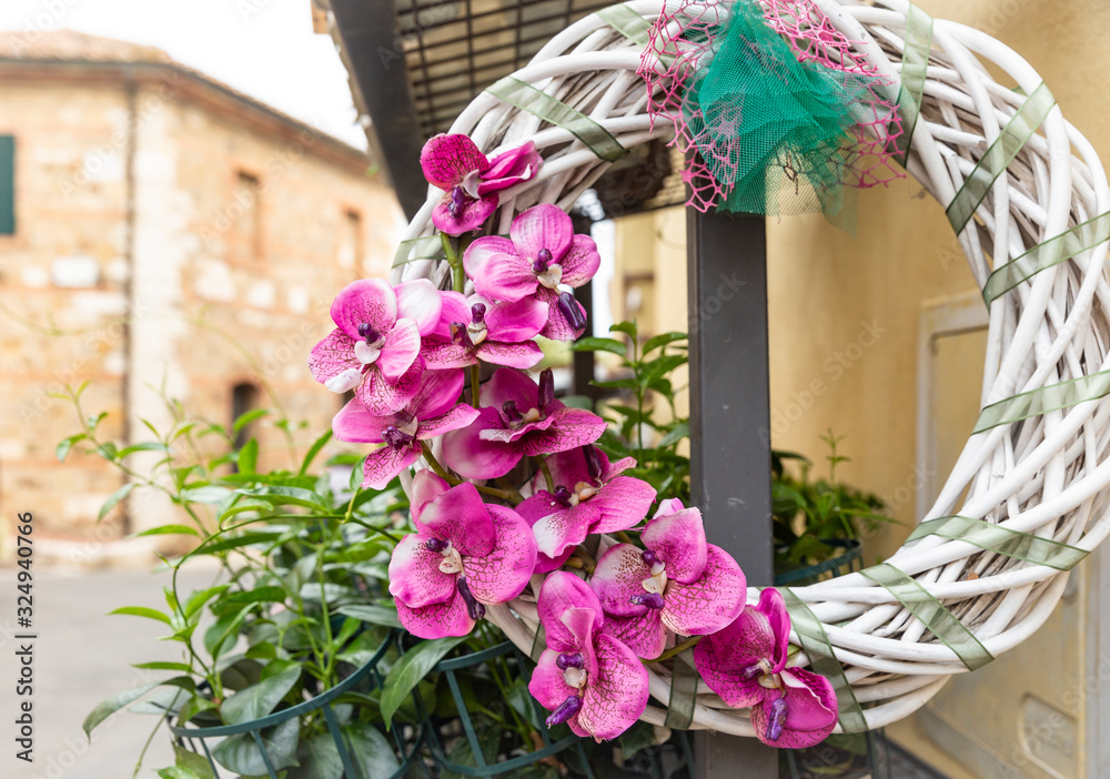 wreath of artificial pink orchid flowers for street decoration