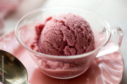 Close up of strawberry ice cream served in cup photo