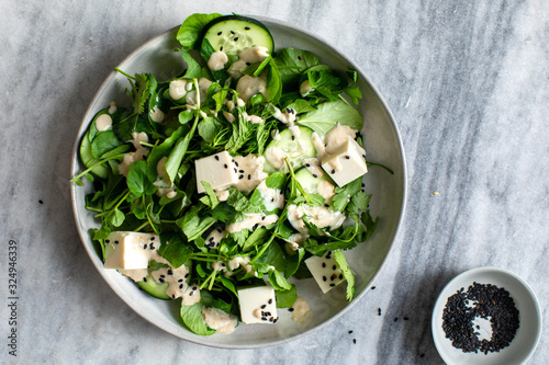 Directly above view of herb salad with tofu and sesame