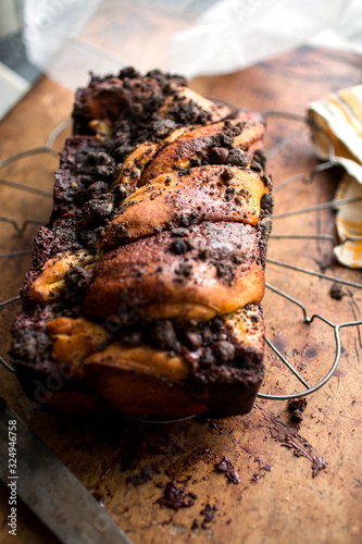 Selective focus of chocolate babka on hot pot stand photo