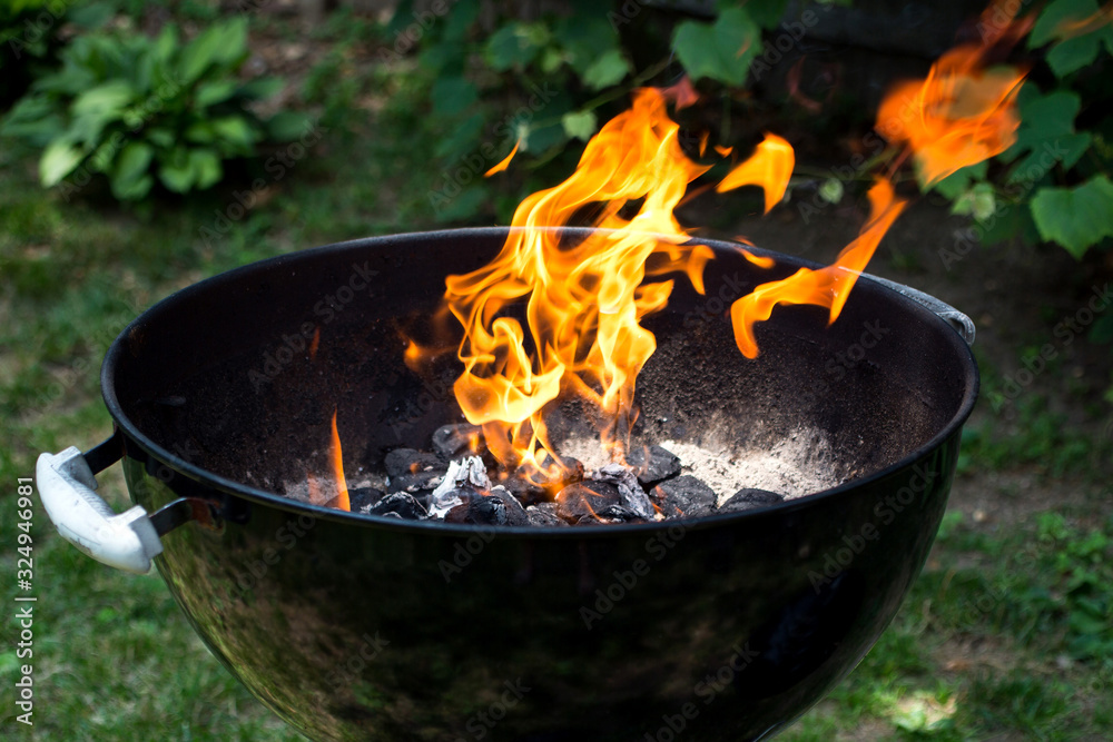 Close up view of barbeque with flames Close up view of barbeque with flames