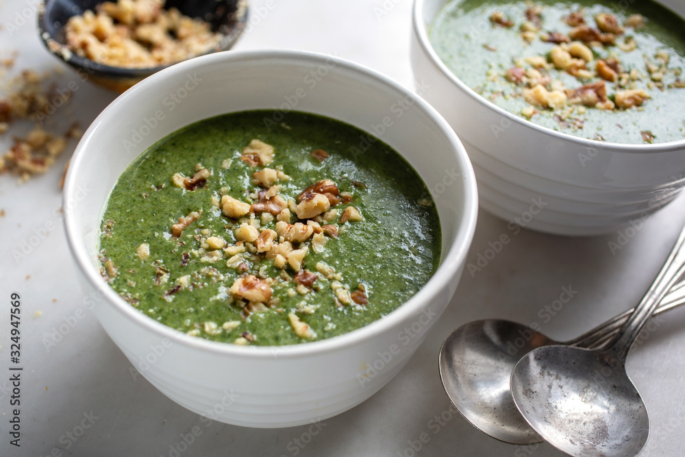 Spinach soup with Middle Eastern spices served in bowl Spinach soup with Middle Eastern spices served in bowl