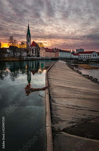 Sunset in Kempten with river and church