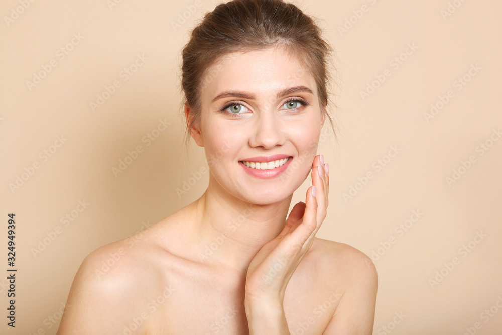 Portrait of a beautiful young girl with nude makeup on a colored background. The concept of healthy and clean skin, skin care. Portrait of a beautiful young girl with nude makeup on a colored background. The concept of healthy and clean skin, skin care.