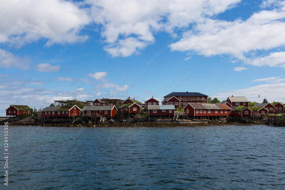 Red norwegian houses on the lofoten built close to the water