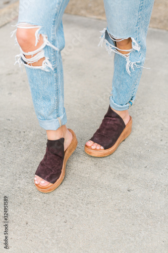 Cute brown leather and wood platform wedges on model