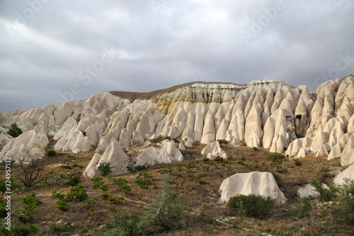 Unusually shaped volcanic rocks in the Valley of Swords near the village of Goreme in the Cappadocia region of Turkey.