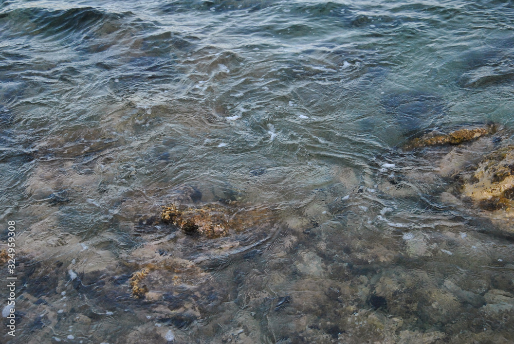 the sea water dancing with the rocks