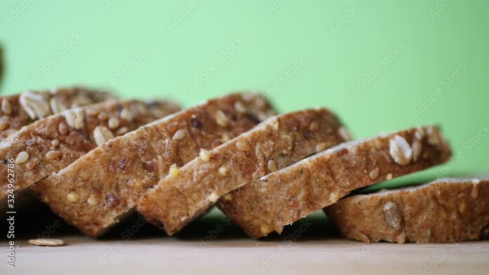 Whole grain bread on wooden table against green screen. Whole grain bread on wooden table against green screen.