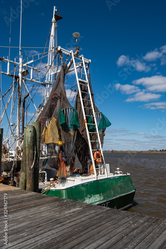 Beautiful color fish netting hanging from a shrimp boat