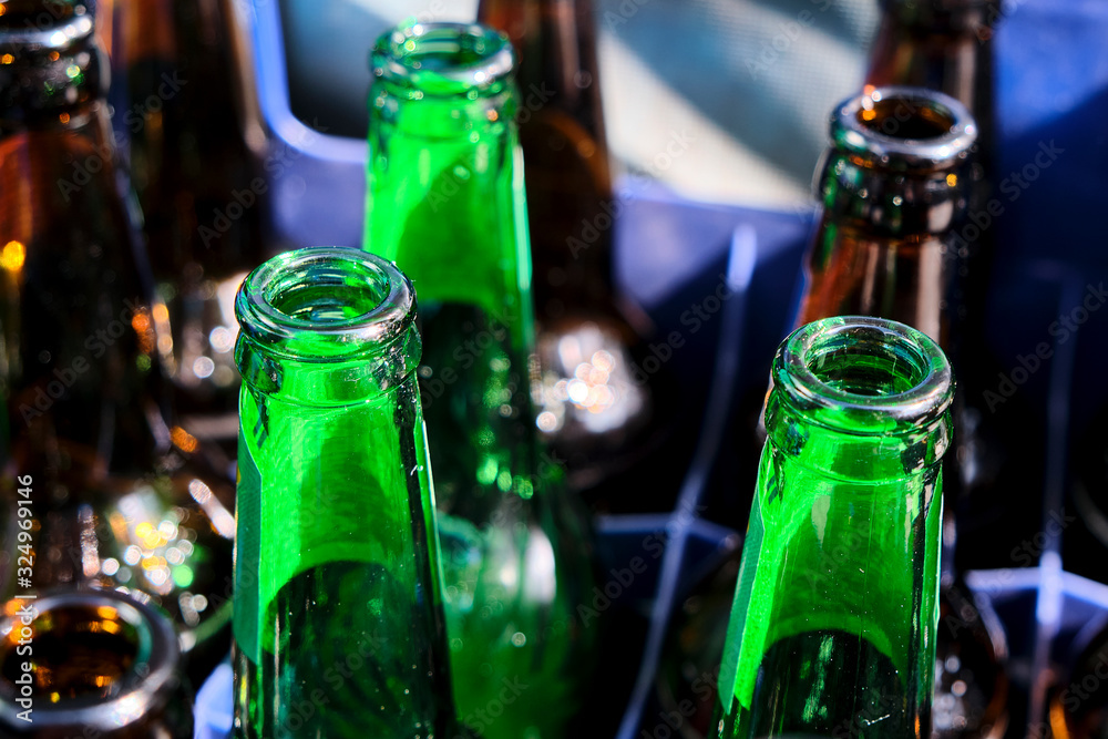 A shot of empy glass bottles ready to be recycled.