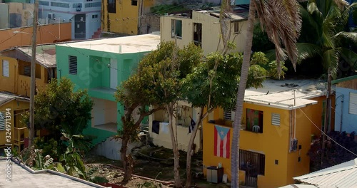 Close up detail angle establishing shot panning over colorful coastal homes in La Perla Puerto Rico