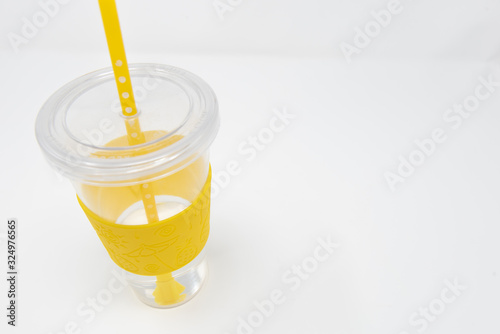 isolated clear yellow water bottle on white background