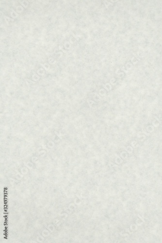 abstract splotchy light grey parchment paper background