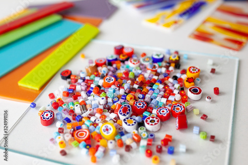 Multi-colored glass for fusing on a white table, close-up photo