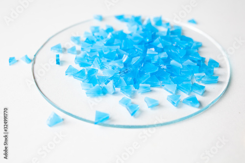 Blue glass for mosaic on a white background photo