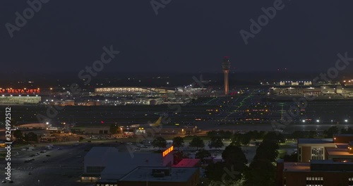 Atlanta Aerial v534 Fast panoramic of airport at dusk, night with numerous planes in sky - July 2019
