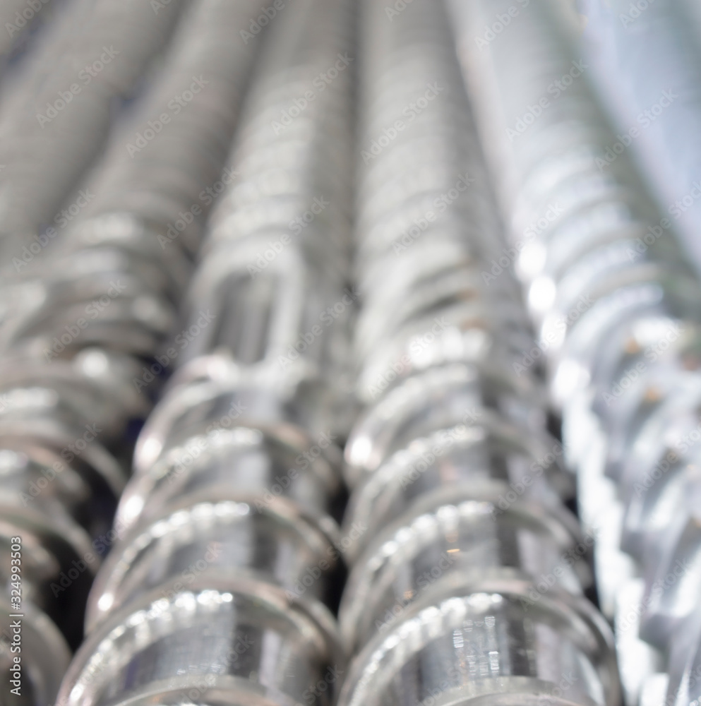 Blurred picture of Screw Press Spare parts for industrial engineering background Blurred picture of Screw Press Spare parts for industrial engineering background