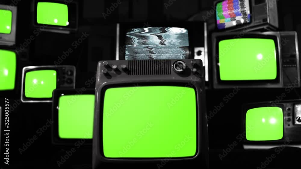 Ten Old TVs turning on Green Screens. BW Tone. You can replace green screen with the footage or picture you want. You can do it with “Keying” effect in After Effects.