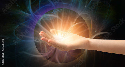 Photos Female hand with shining energy on dark background