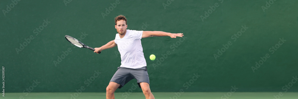 Tennis player man header banner hitting ball with racket on green horizontal copy space background. Sports athlete training forehand grip technique on outdoor court.