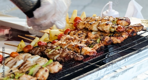 Pork and Chicken Barbecue with Tomatoes and Pineapple photo