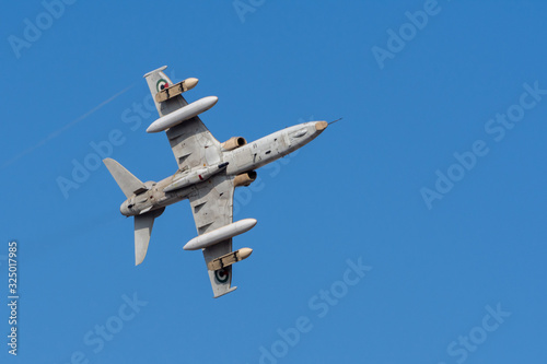 Military fighter jet flying fast through the air in coordination with team. War, combat, teamwork, precision concepts. UAQ Union Fortress 7 photo