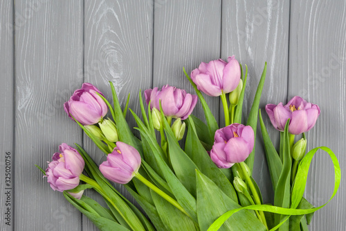 Fototapeta Naklejka Na Ścianę i Meble -  bouquet of pink tulips on wooden background