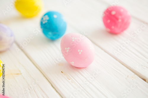 Easter eggs on a white wooden surface