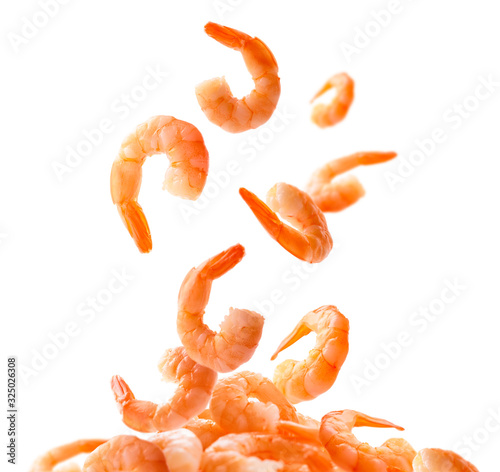 Boiled prawns levitate on a white background photo