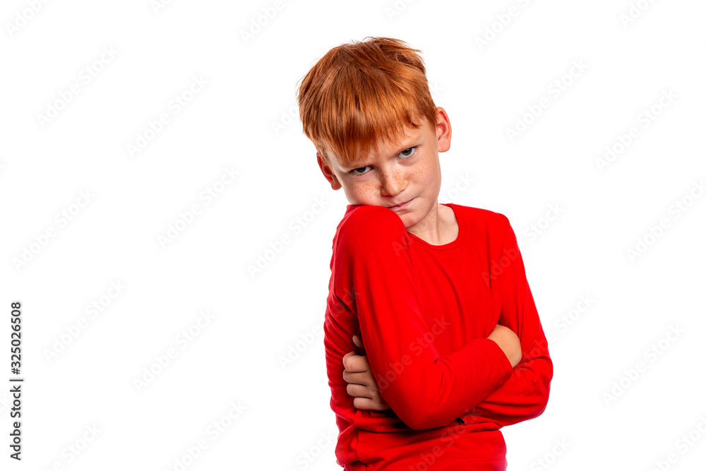 Shot of attractive red-haired hurting boy wearing red shirt, isolated Shot of attractive red-haired hurting boy wearing red shirt, isolated