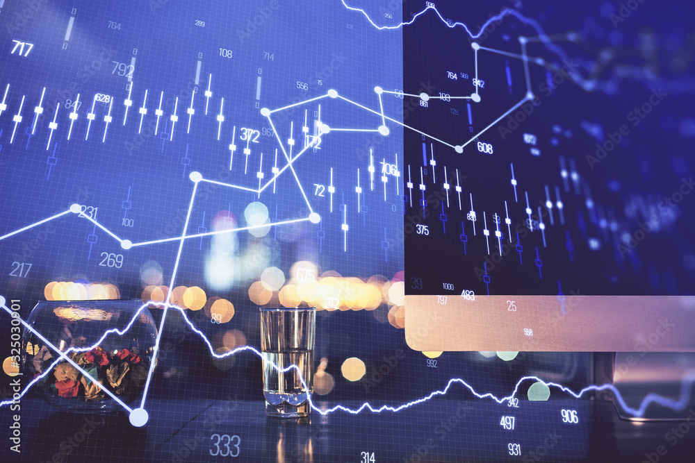 Financial graph colorful drawing and table with computer on background. Double exposure. Concept of international markets. Financial graph colorful drawing and table with computer on background. Double exposure. Concept of international markets.