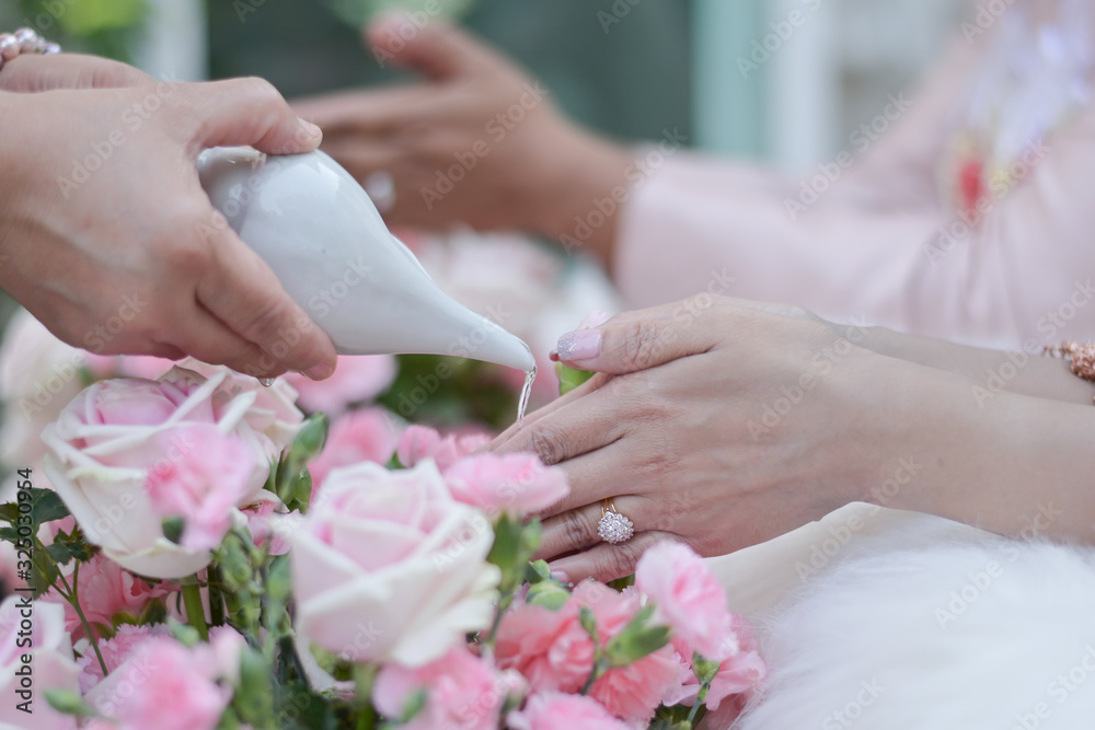 hands of bride and groom with wedding rings hands of bride and groom with wedding rings